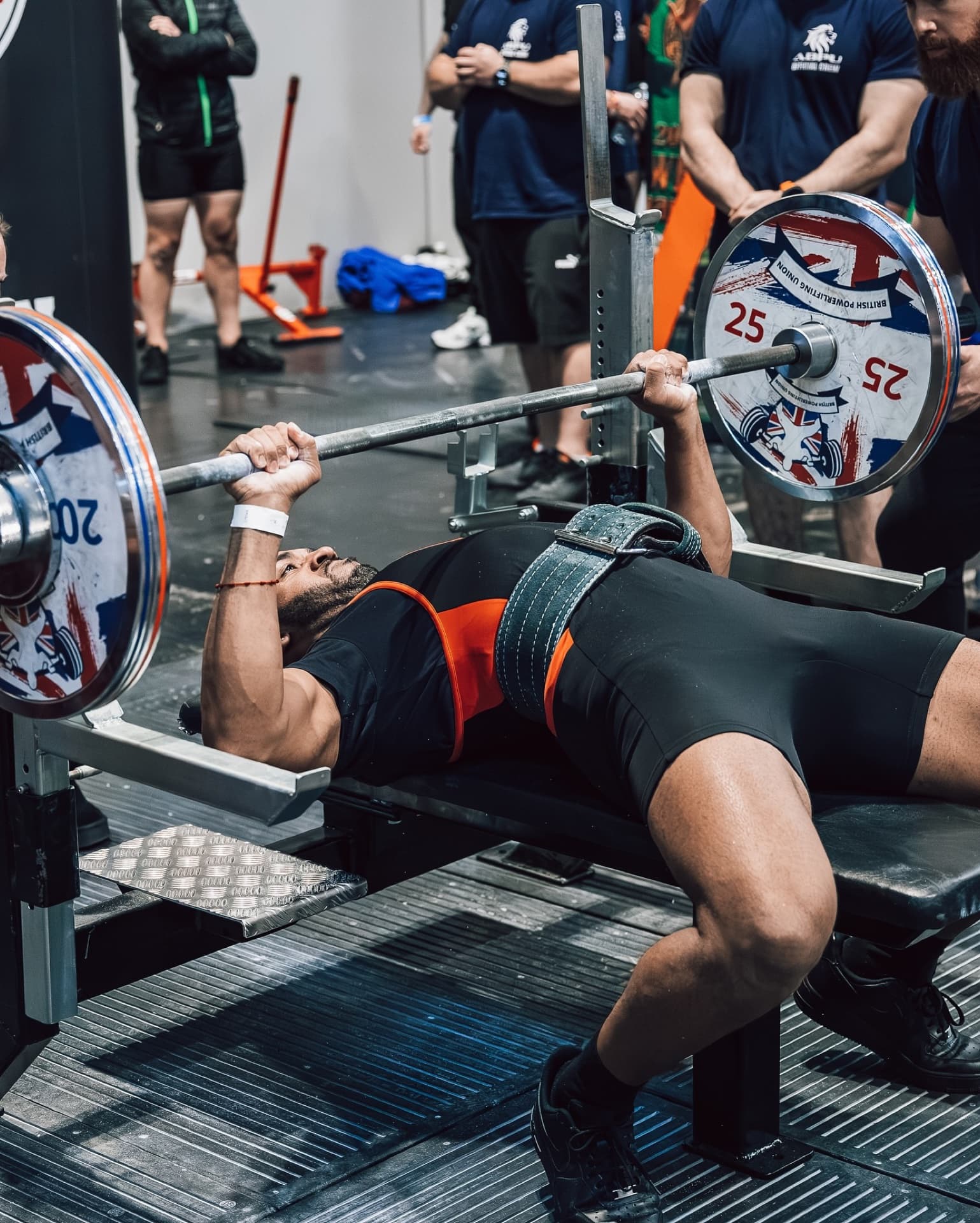 Cameron bench pressing at competition